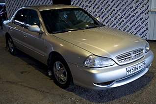 1280 X 850 216.6 Kb Kia Clarus 2000 .